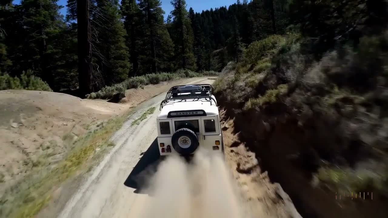 SUV on a Dusty Mountain Road